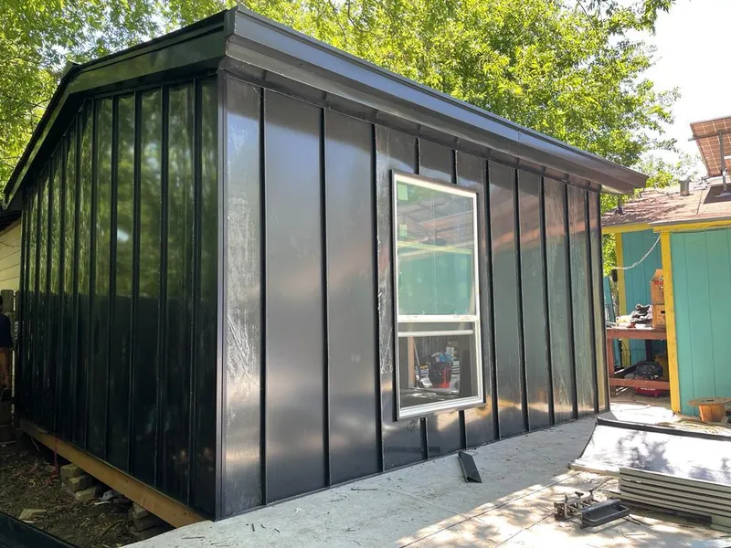 Black standing seam metal wall panels for Roof Inspection in Ellettsville